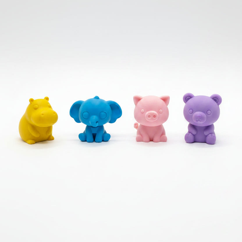 Three small colorful animal figurines